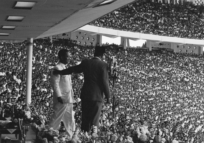 Anniversary celebration for Indonesian Communist Party, Jakarta, 23 May 1965. President Sukarno appears at ease with PKI Secretary General DN Aidit. What happened to all those happy supporters? (AP/Howard Sochurek)